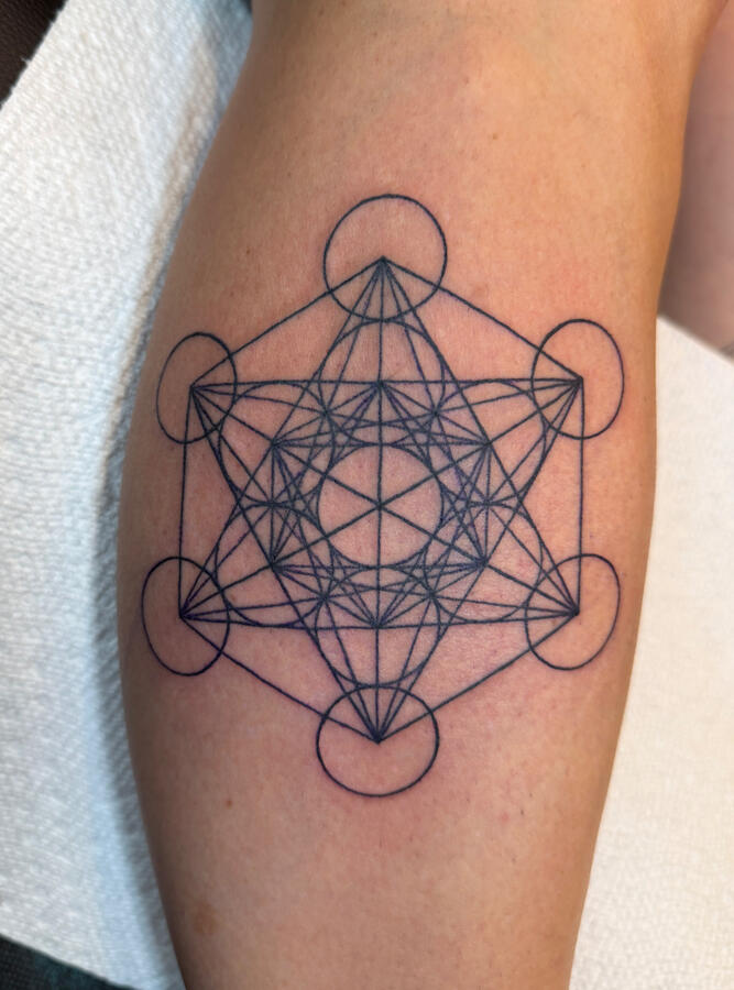 Sacred geometry artwork tattoo done in the fine line tattoo style