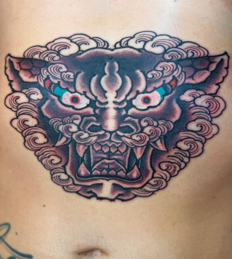 Traditional Japanese foo dog tattoo on clients belly