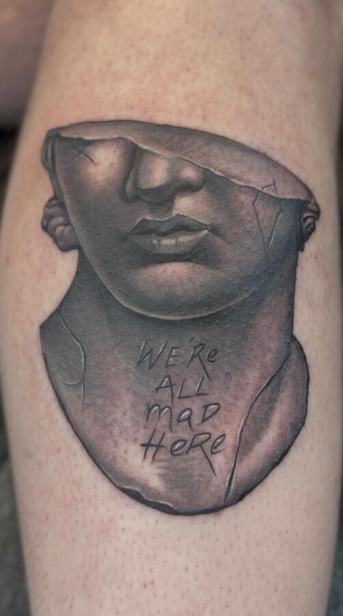 Realistic style black and gray tattoo of Greek statue