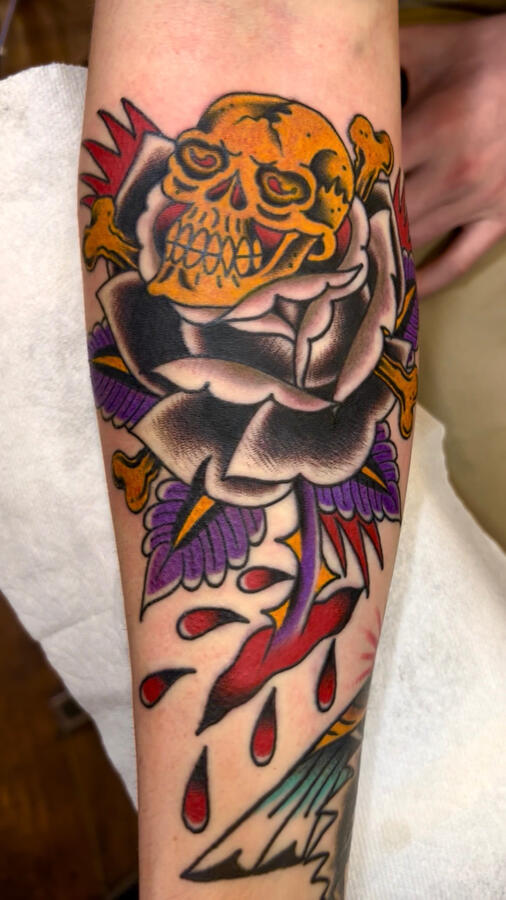 Bold colorful traditional black rose and skull tattoo